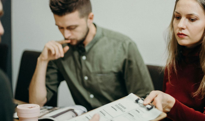 man working on worksheet